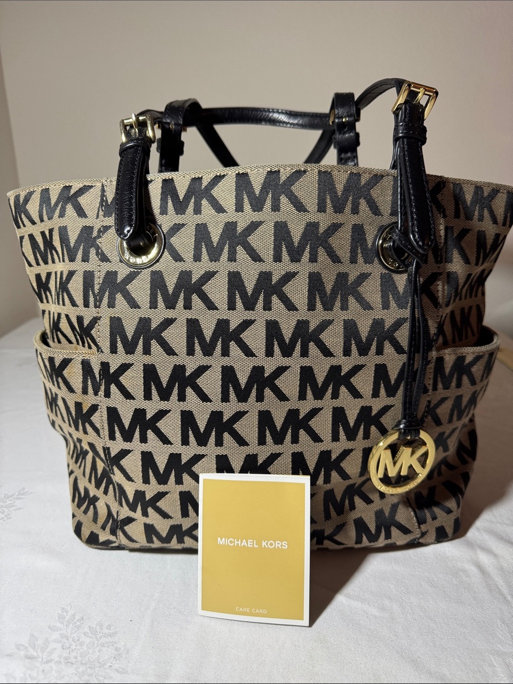 Michael Kors Black and Tan Signature MK Tote with Gold Hardware